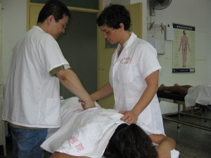 Jennifer Ross performing tuina on a patient at Zhejiang Chinese Medical University in Hangzhou, China
